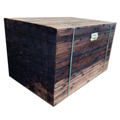 Pallet of brown feather edge fence boards for closeboard fencing